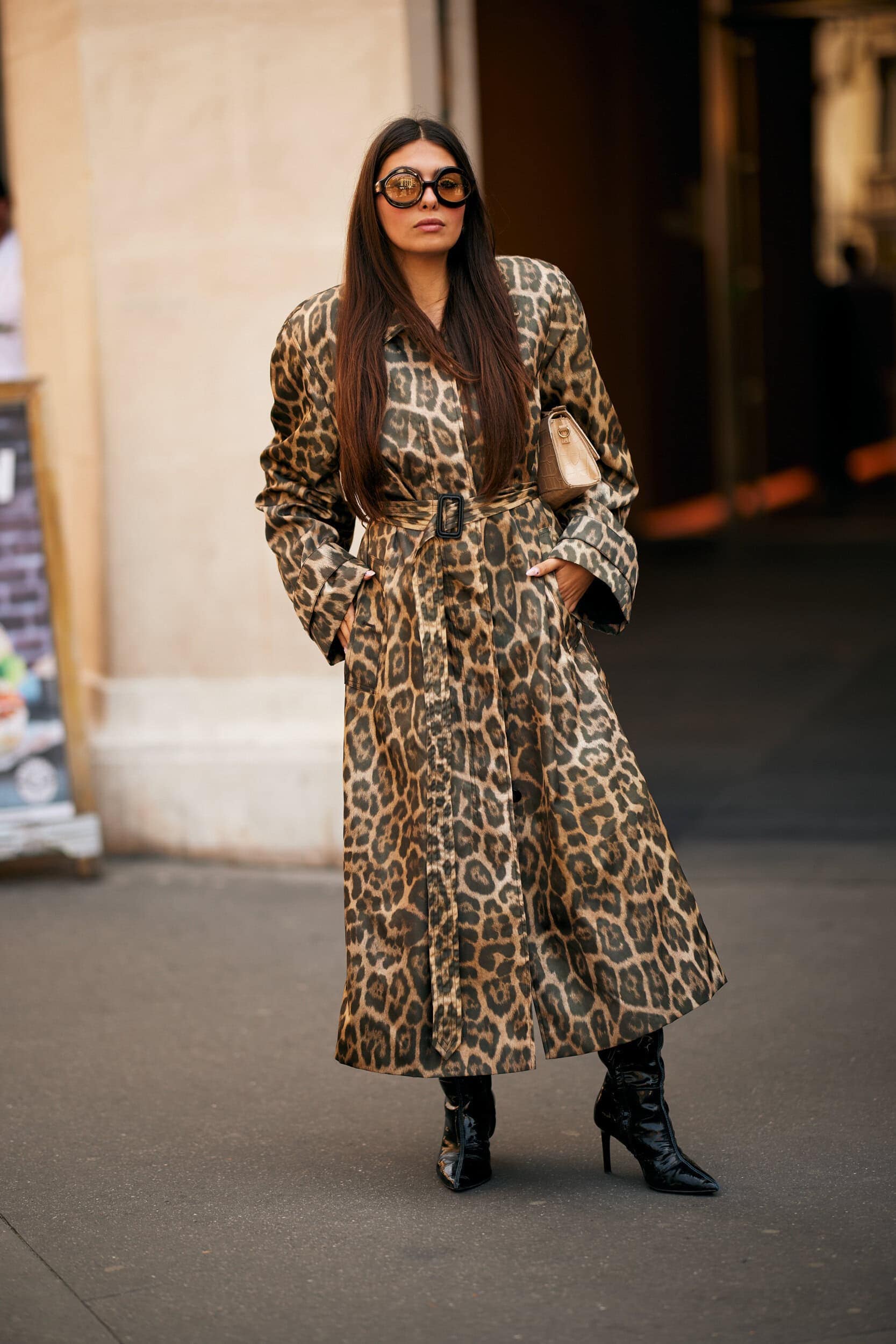 Street style look with a belted leopard print coat