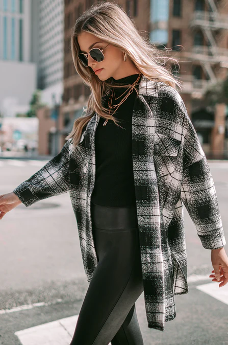 Woman wearing a plaid shacket jacket