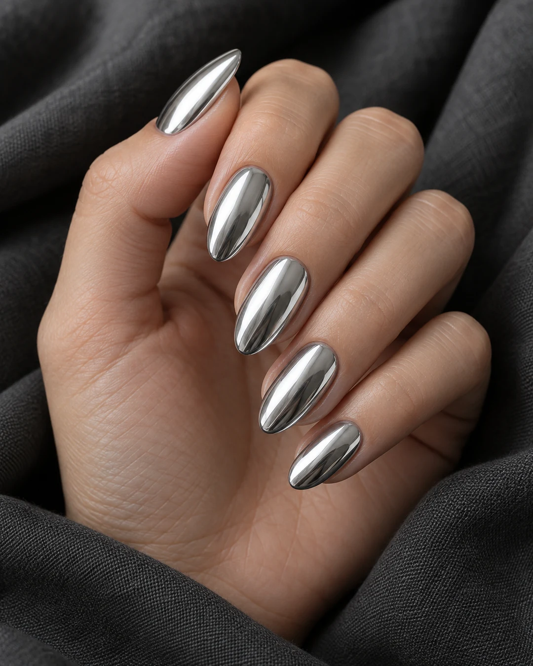 Medium almond nails in mirror-chrome silver