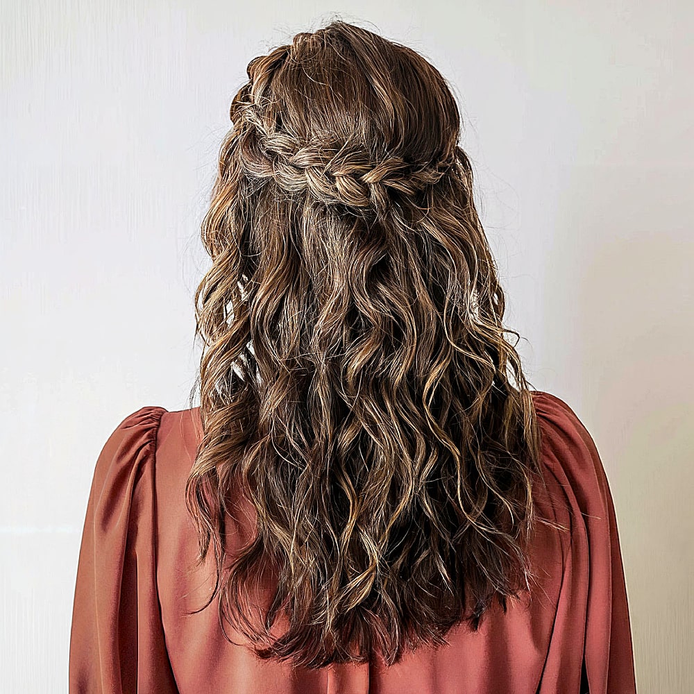Braided half-up hairstyle with volume at the crown