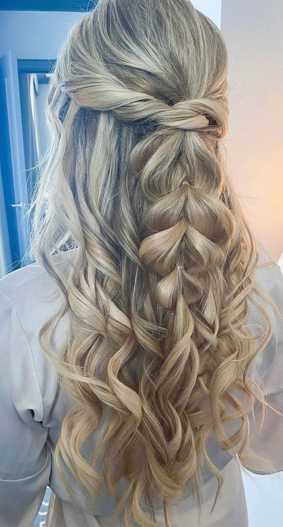 Half-up twisted hairstyle with textured volume for a formal evening