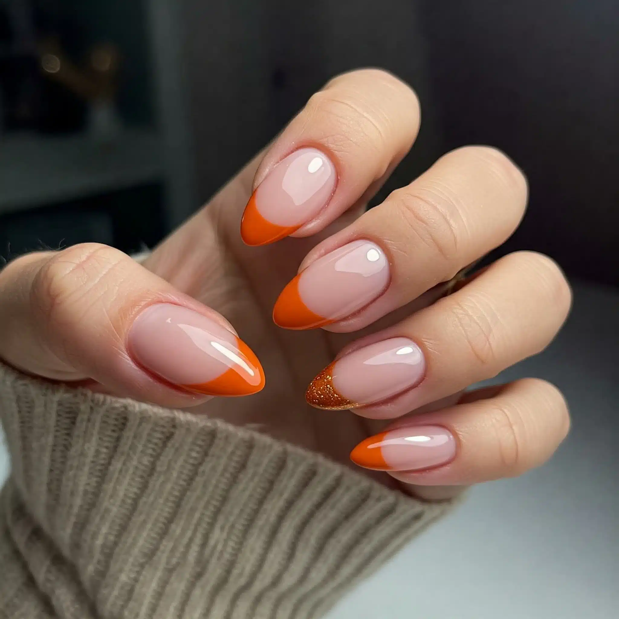 Nude nails with pumpkin spice orange French tips