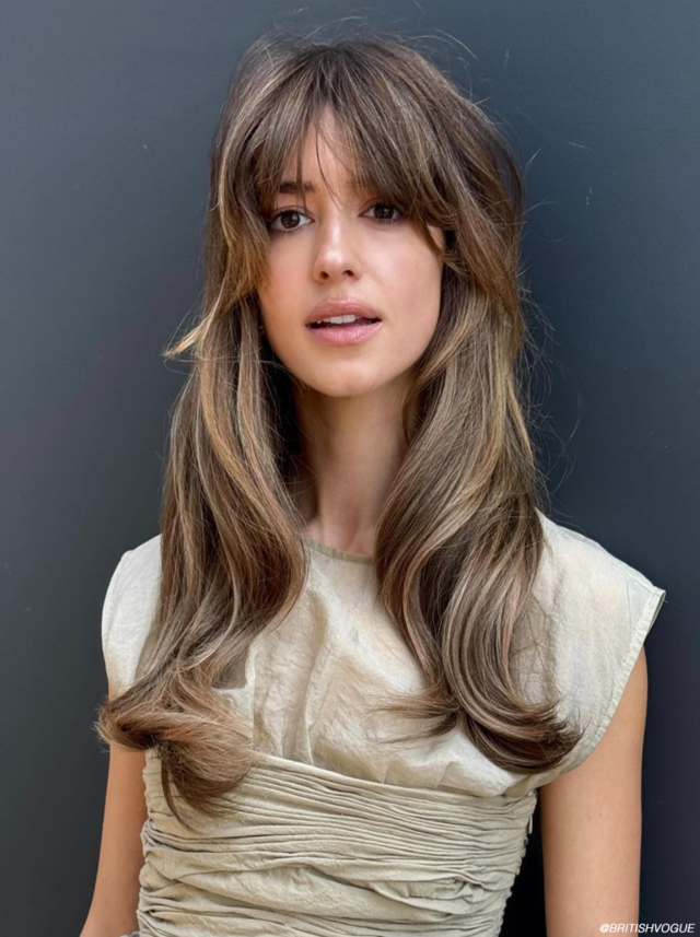 Tousled shag haircut with curtain bangs