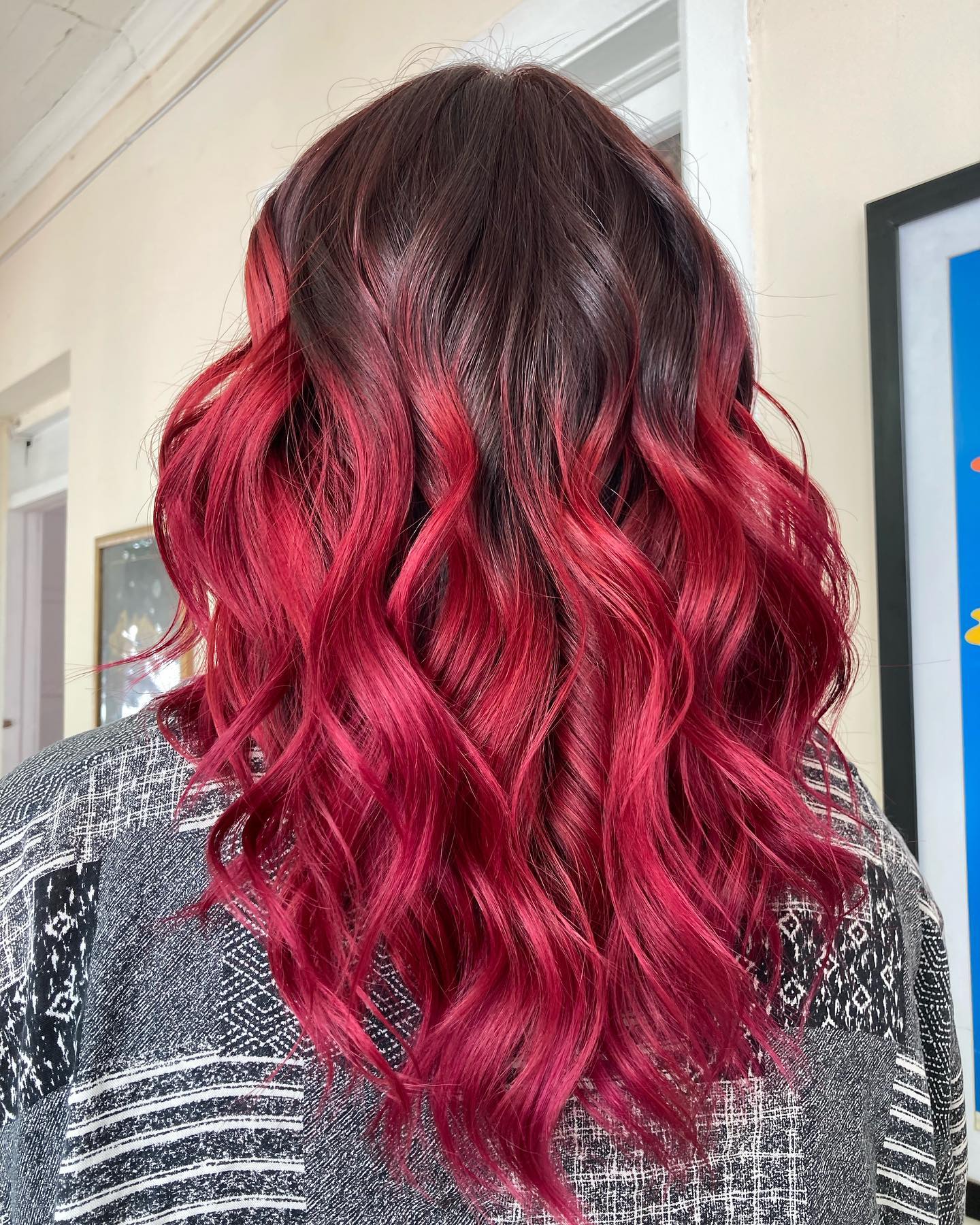 Red velvet hair color with rich cocoa-red tones and soft waves