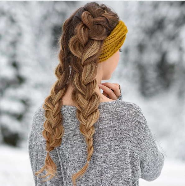 Back view of a loose fishtail braid dusted with snow