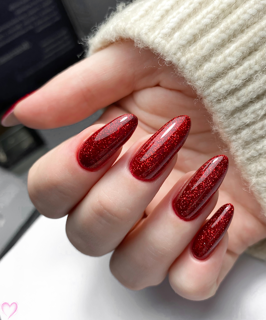 Almond nails in deep garnet red glitter