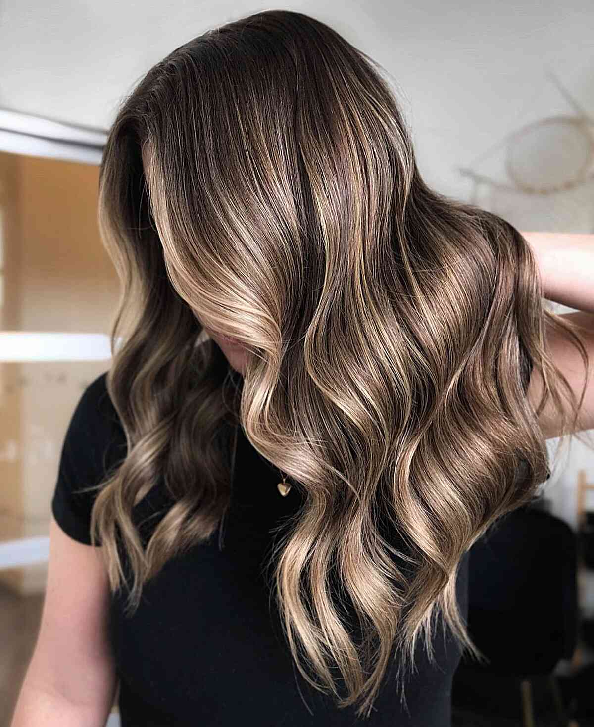 Bronde balayage blending brown and blonde on mid-back hair