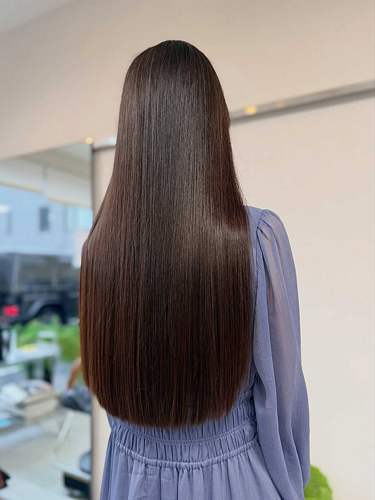 Long dark chocolate brown hair with high-gloss liquid shine