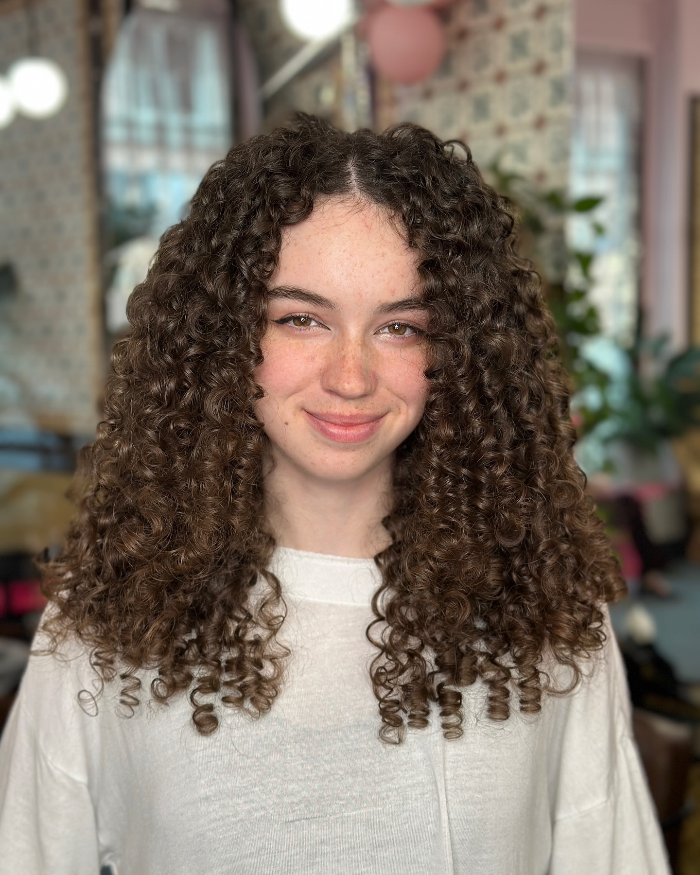 Rich cocoa brown natural curls with lustrous shine