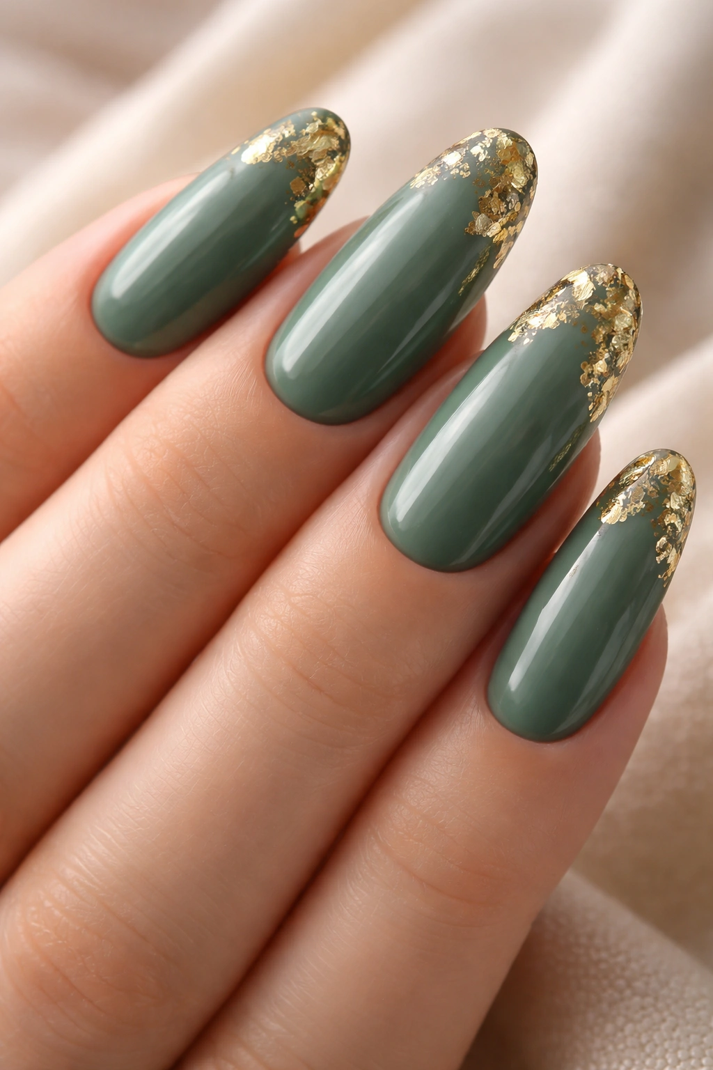 Sage green nails with gold foil edge detail