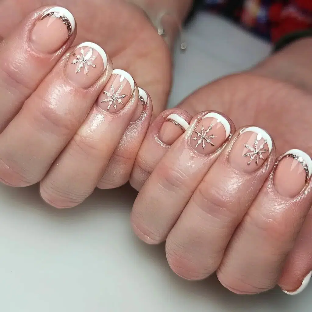 Short white French tip Christmas nails with silver snowflakes