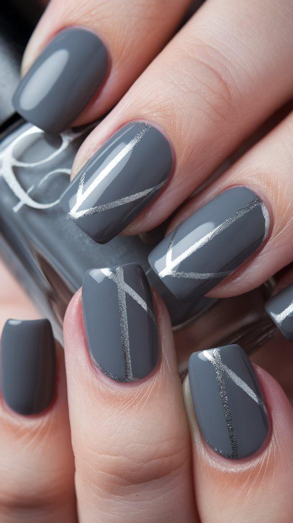 Medium-length squoval nails in glossy storm gray with thin metallic silver line art