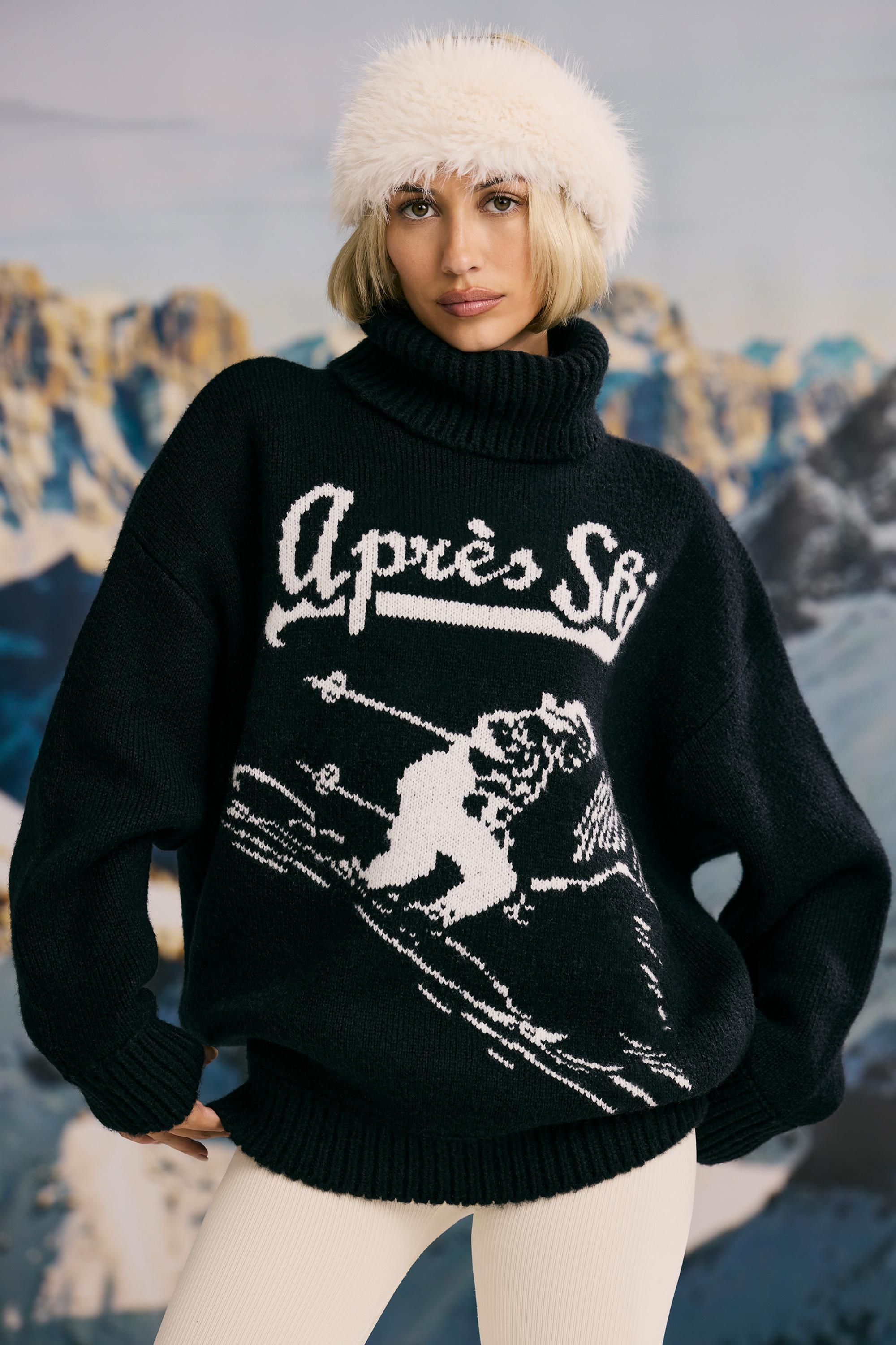 Product photo of a black oversized chunky knit turtleneck sweater