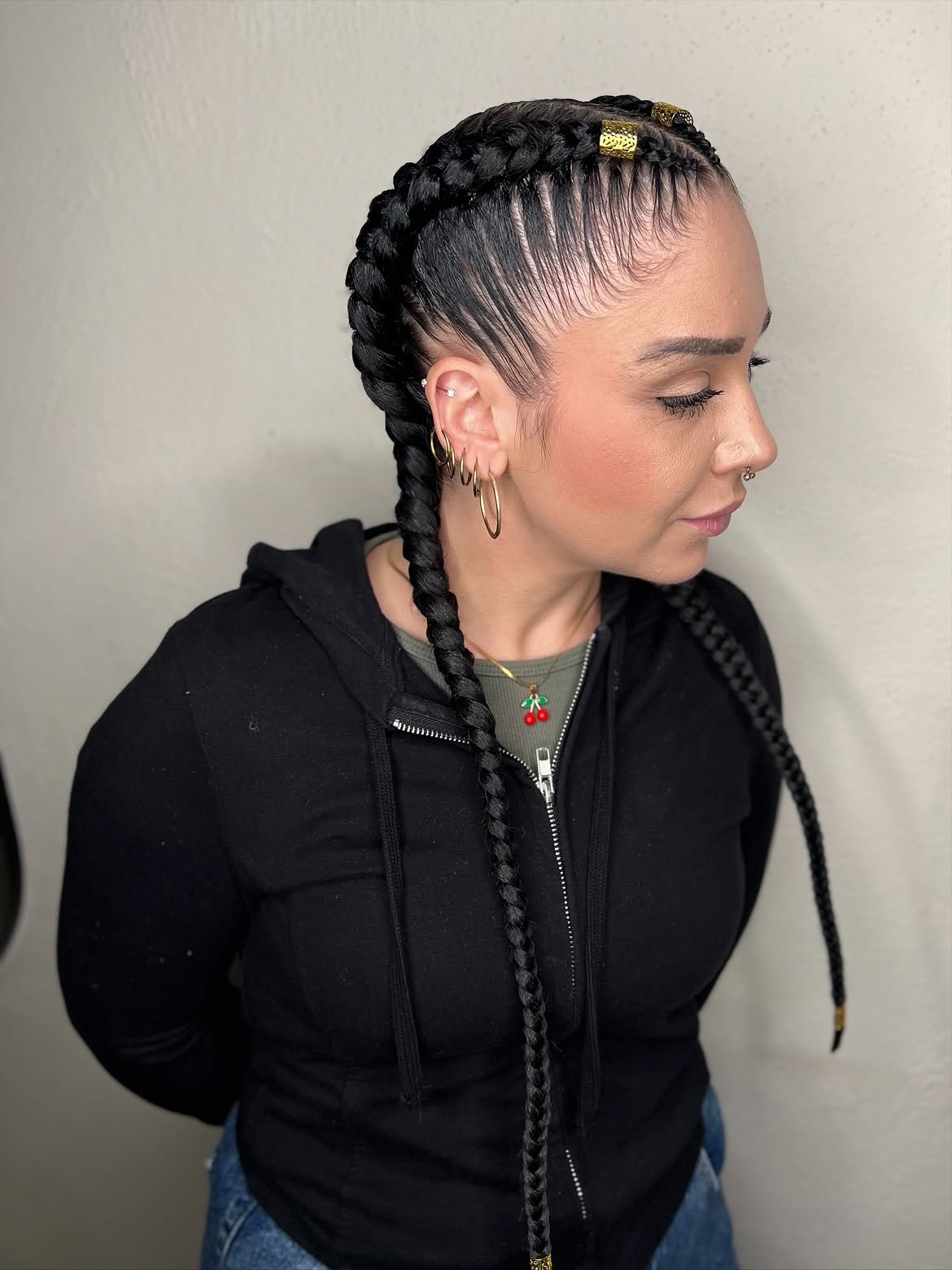 Sleek double Dutch braids with styled baby hairs