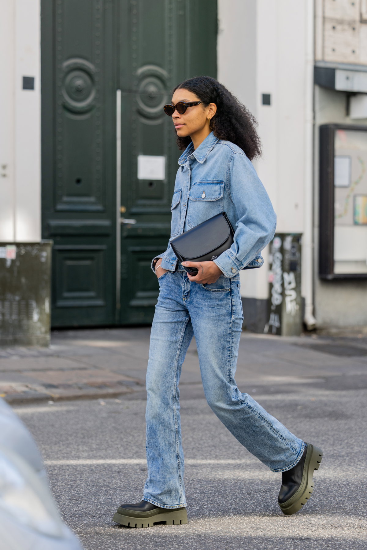 Woman in denim jacket street style