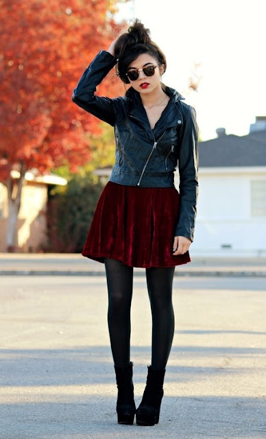 Woman in a black leather jacket street style outfit