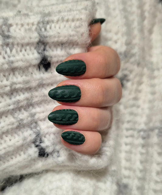 Deep forest green nails with cable-knit sweater accents