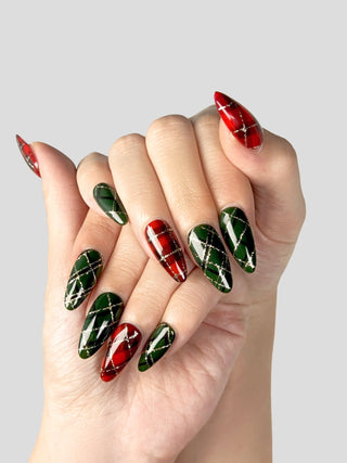 Red and green tartan plaid stiletto nails with thin gold lines