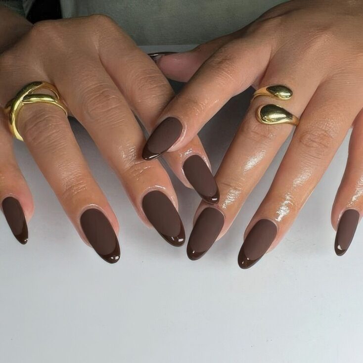 Almond nails in matte dark chocolate brown with glossy brown french tips
