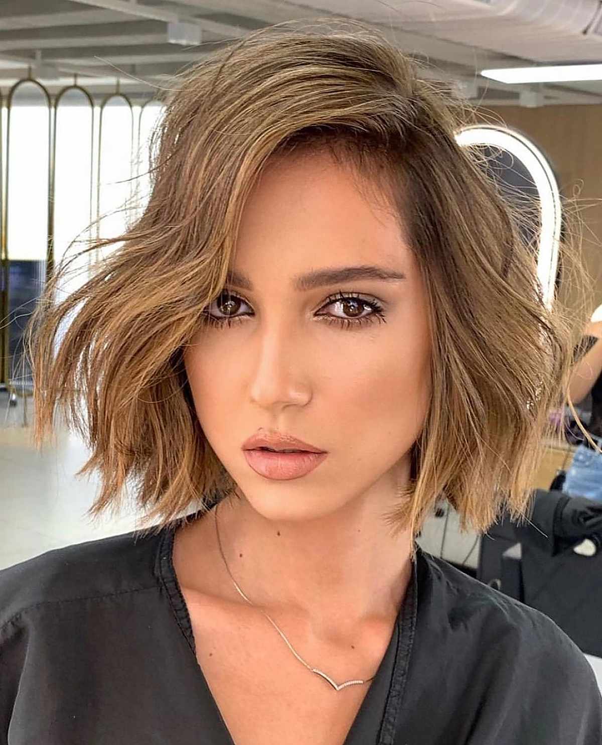 Textured wavy bob with a deep side part
