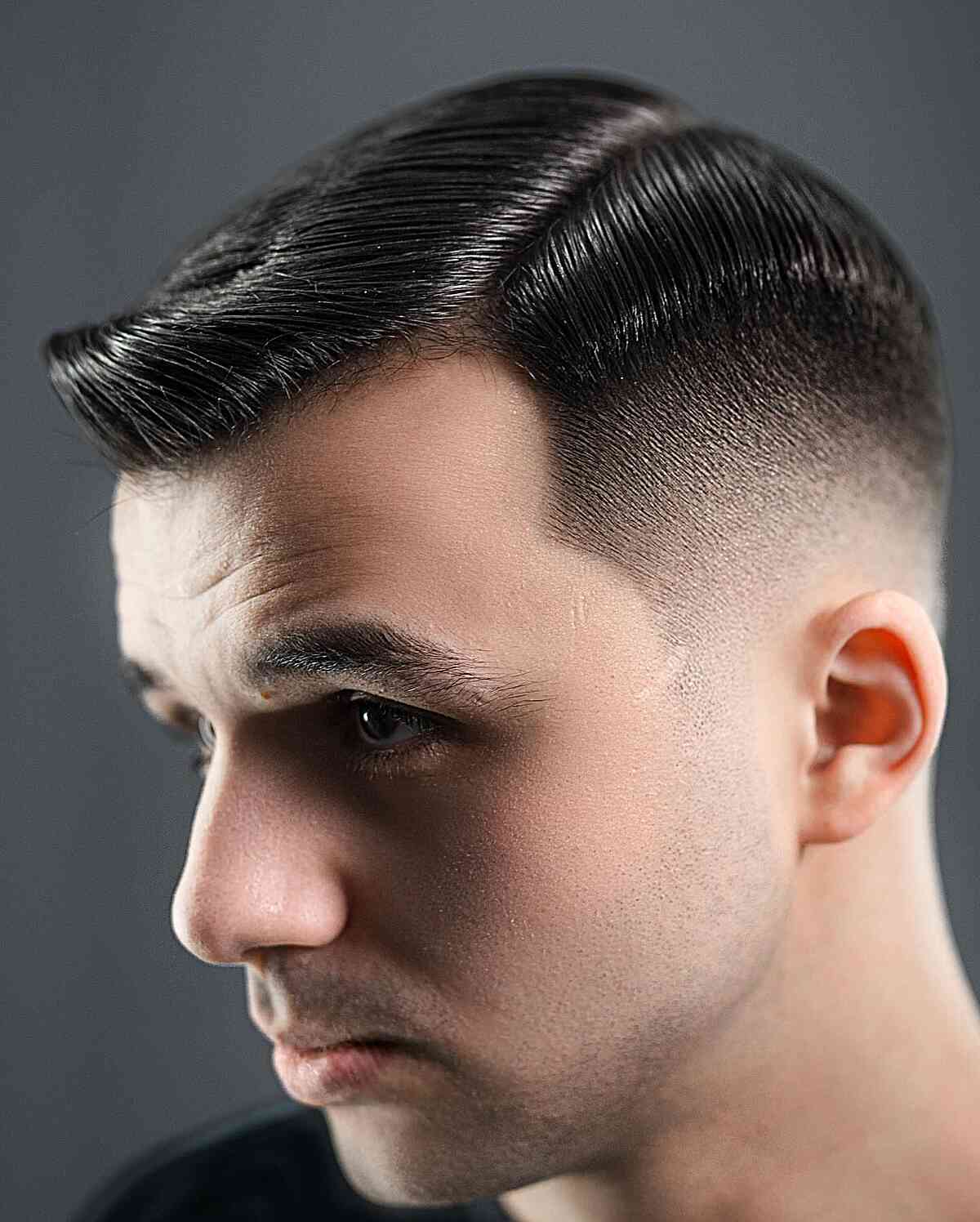 Man with an Ivy League haircut and natural side part