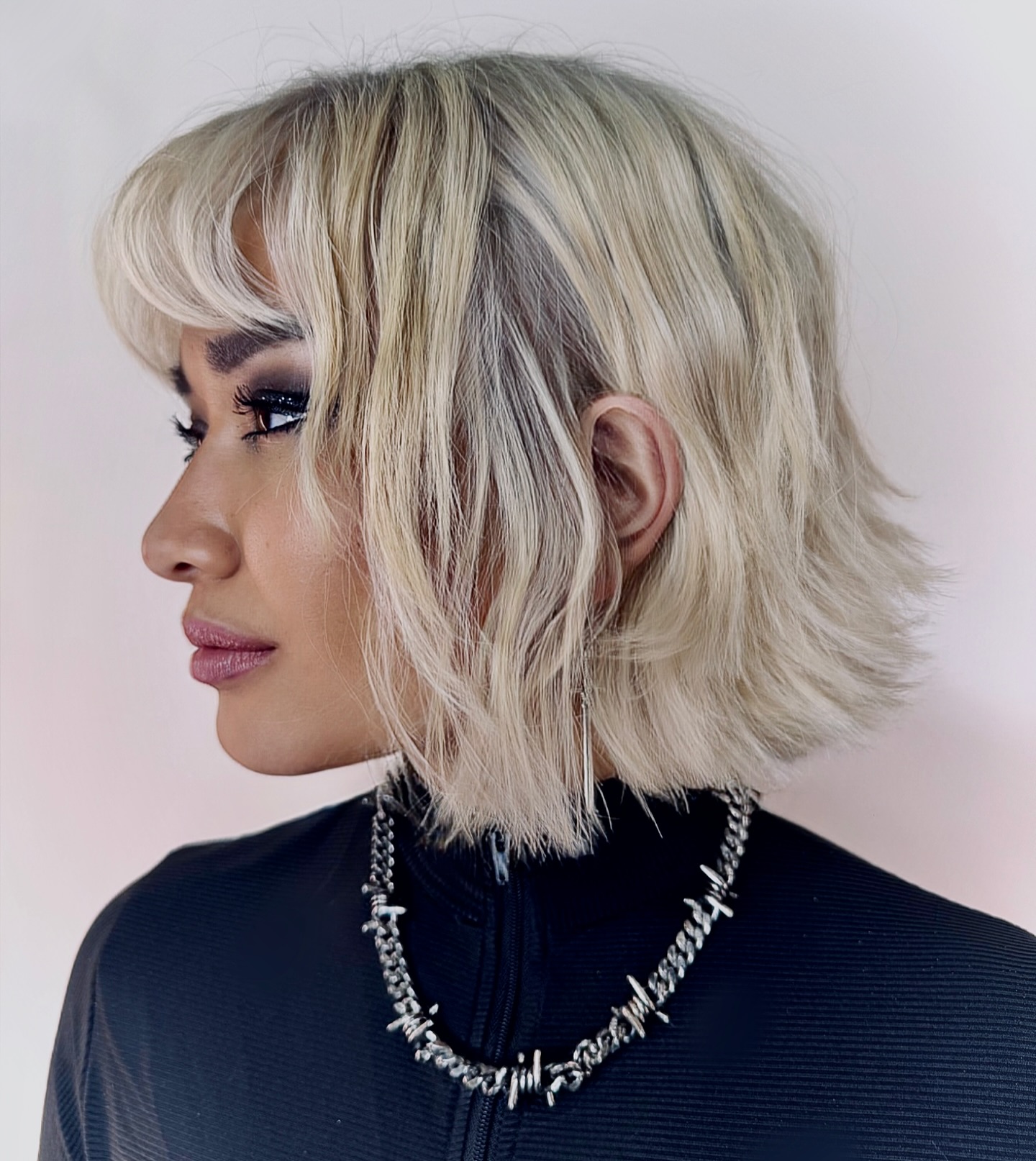 Blonde textured bob with flipped-out ends, side view