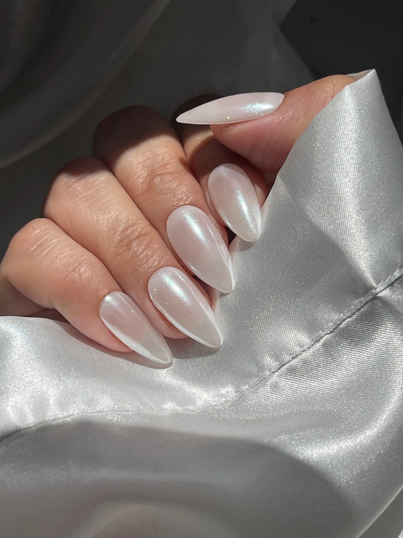 Frosted white chrome gel nails with a pearly finish
