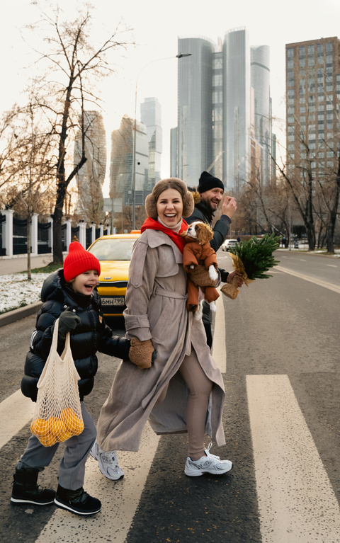 Family wearing trench coats for a winter photo session