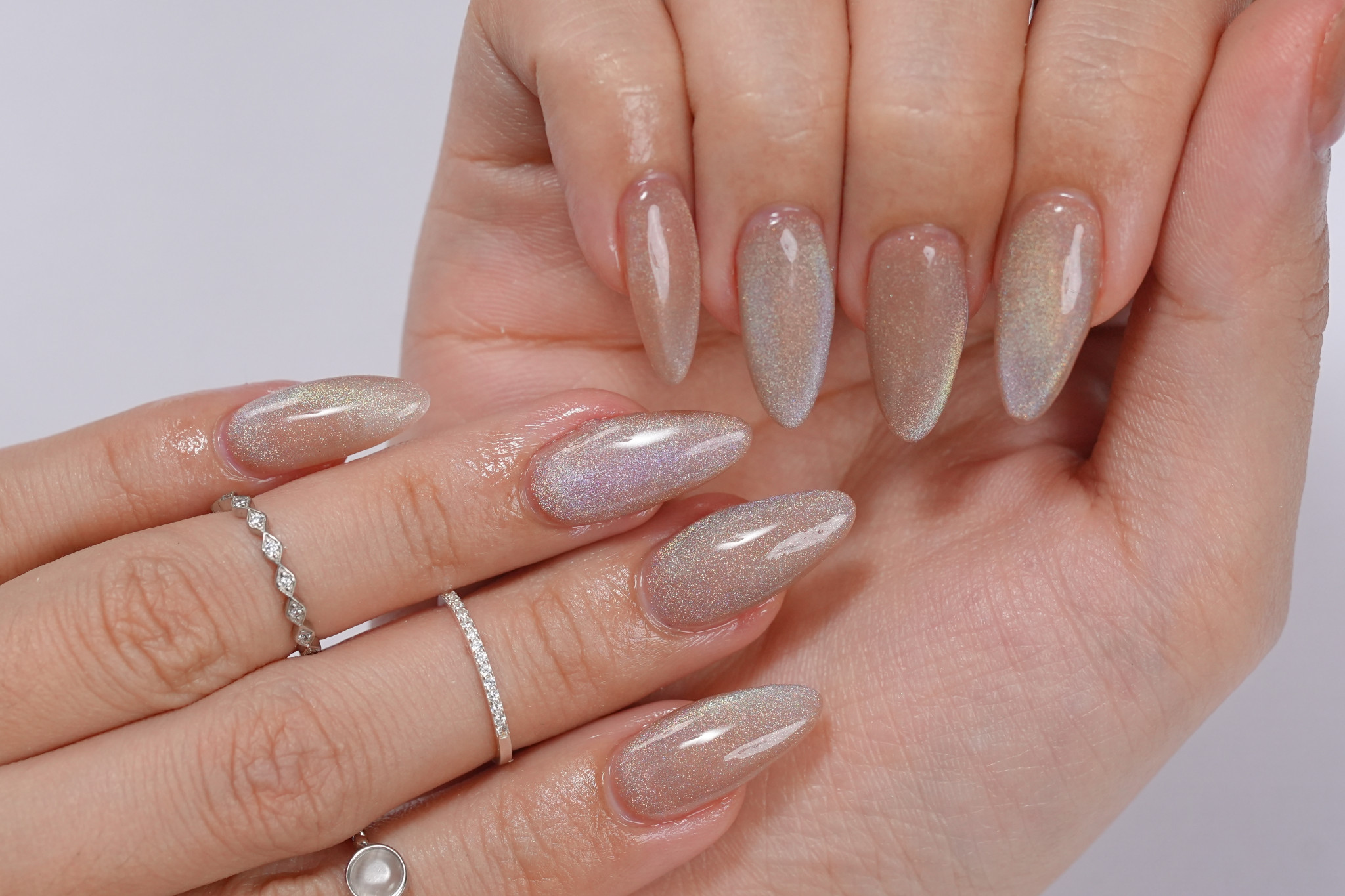 Almond nude nails with shimmering velvet cat-eye finish