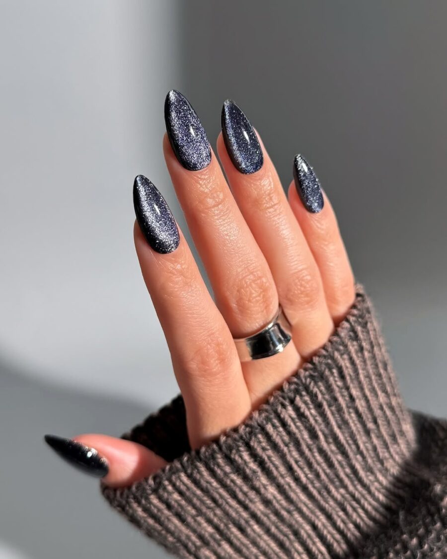 Almond nails in black velvet with silver shimmer