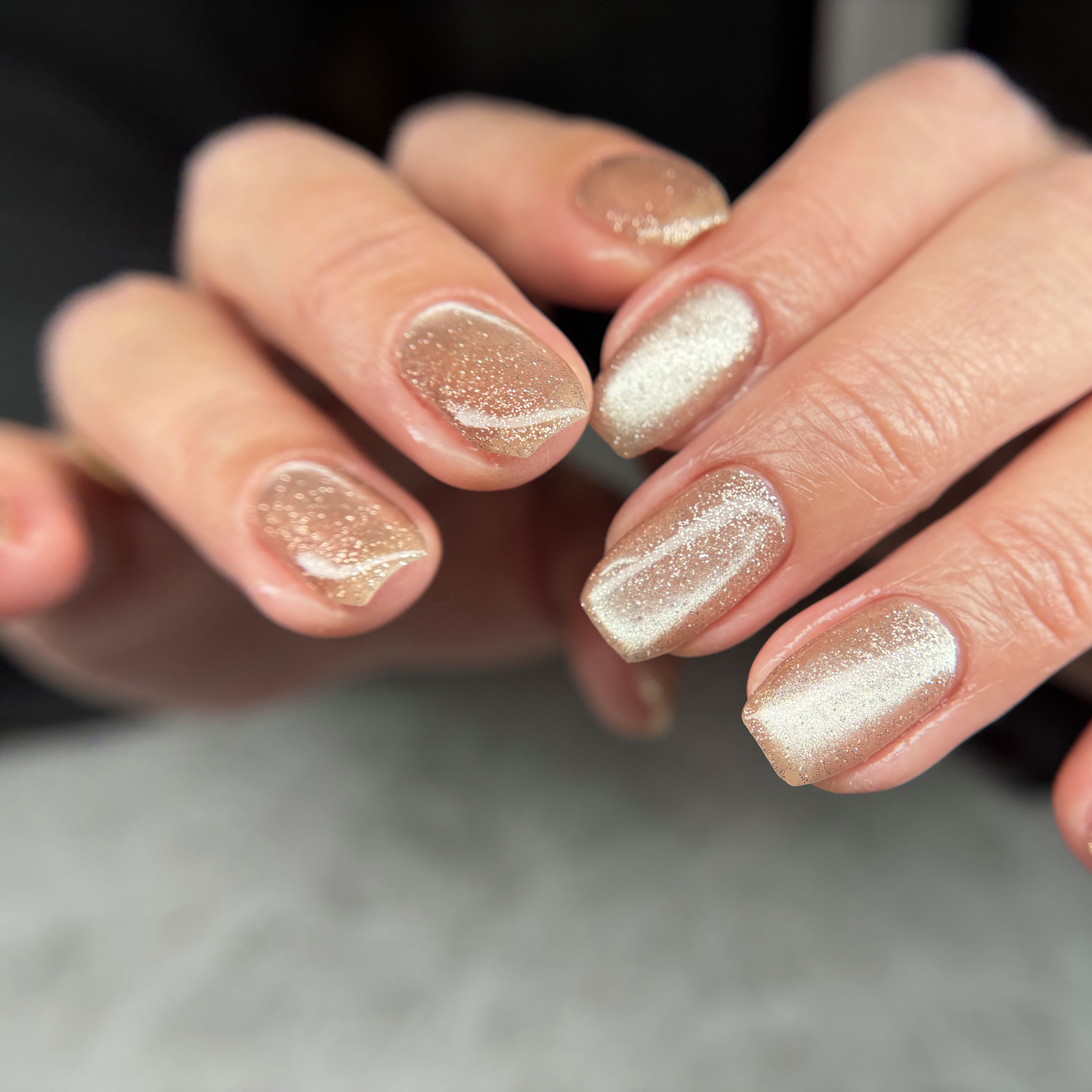 Short square nails with all-over champagne gold shimmer