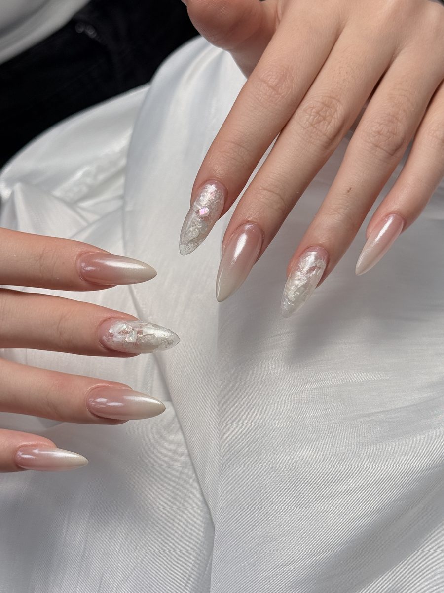 Sheer white nails with a pearl powder gradient