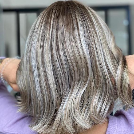 Wavy mushroom blonde bob with ash lowlights, back view
