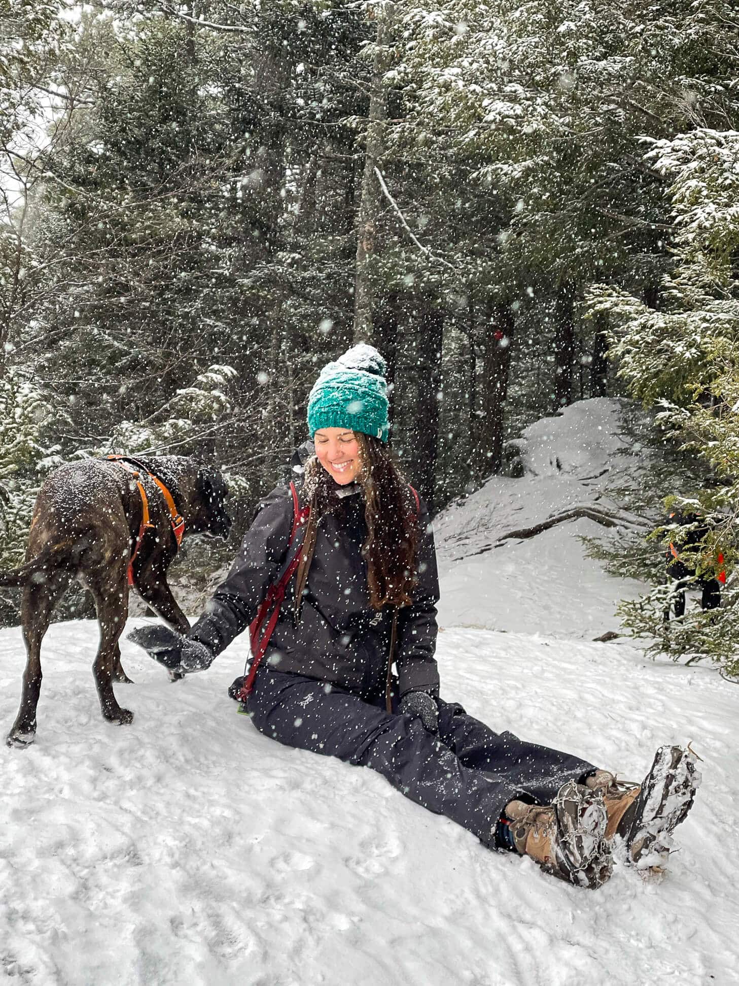 Woman dressed for winter hiking in snow