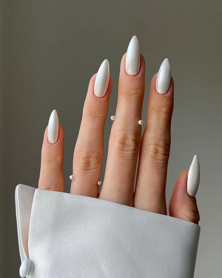 Winter White Chrome: a pearl-white chrome on medium almond nails