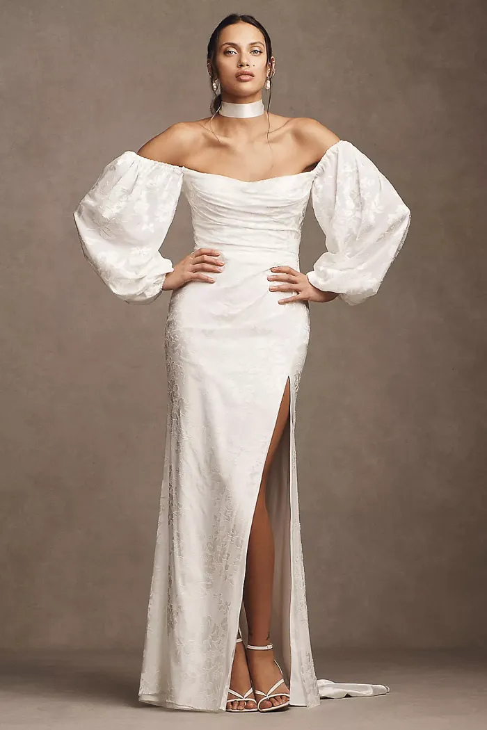 White off-the-shoulder jacquard gown with balloon sleeves and thigh slit