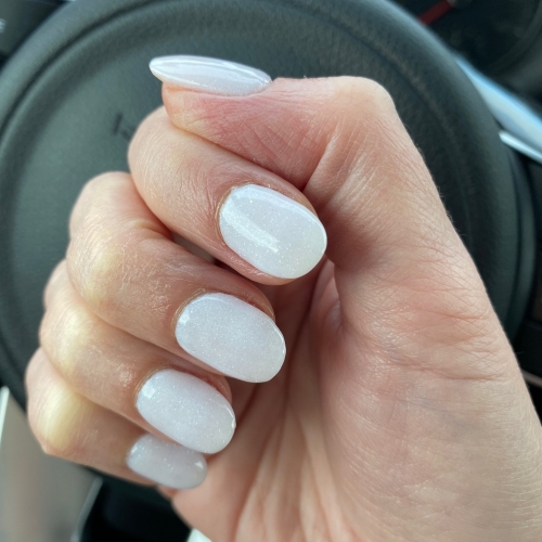 Short nails with milky white polish, soft opaque white winter manicure