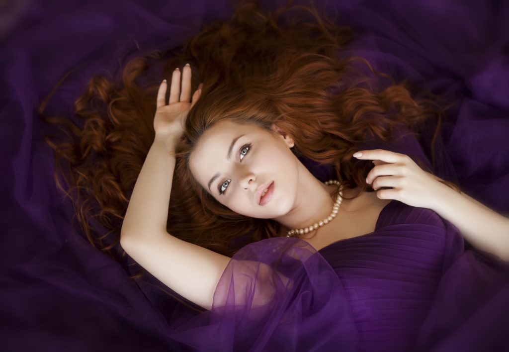 Auburn red hair with warm copper undertones on fair skin