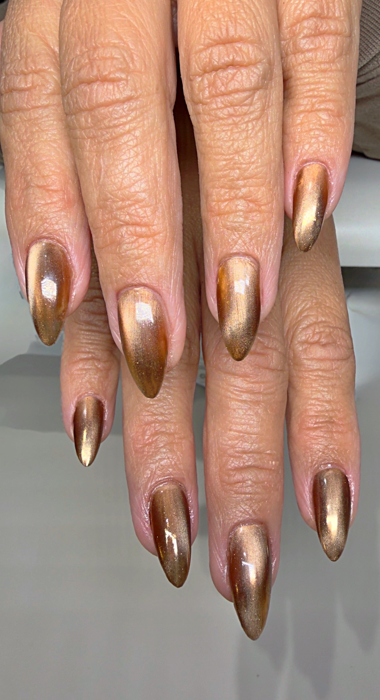 Long almond bronze chrome nails